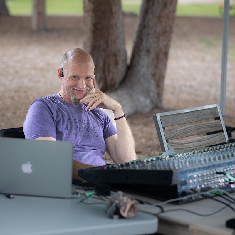 Sound tech operator smiling at the camera